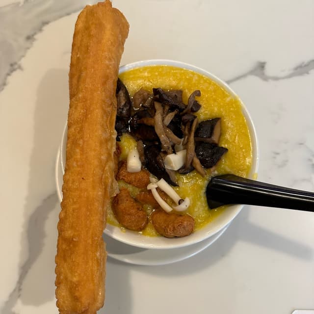 Photo of the dish “Golden Pumpkin Porridge with Trio Mushroom”