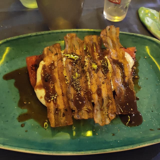 Photo of the dish “Anguria alla Piastra Con Crema Di Ricotta E Bacon Croccante”