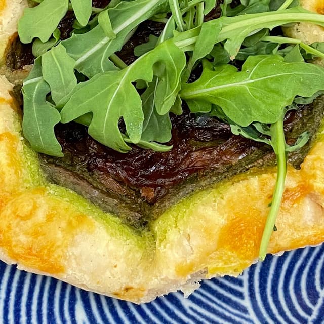 Photo of the dish “Pesto, Onion & Arugula Galette”