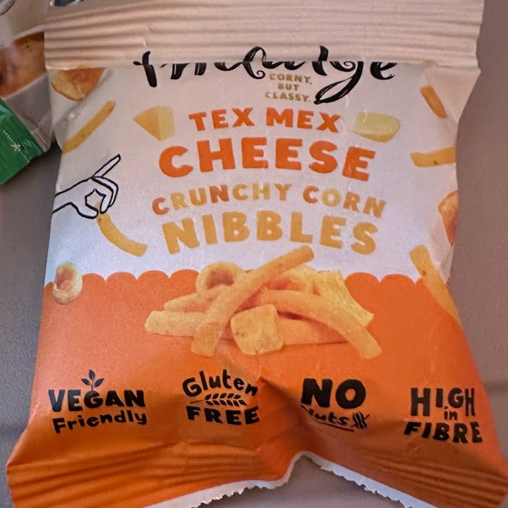 photo of Indulge Tex Mex Cheese Crunchy Corn Nibbles shared by @veganosaurus on  02 Oct 2025 - review