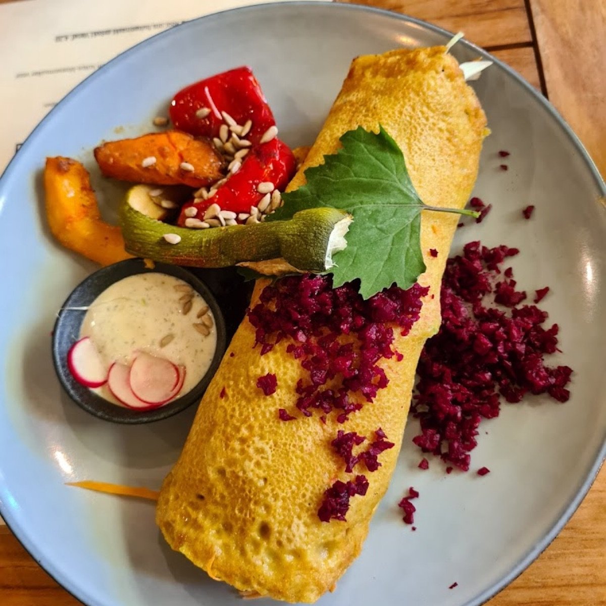 Delicious vegan seitan wrap with roasted bell peppers and sweet potato wedges