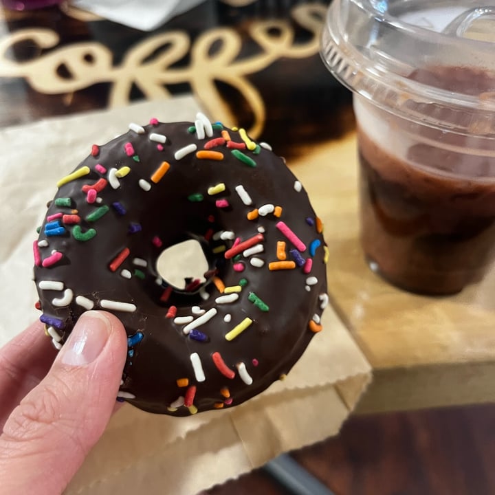photo of Peace Love Coffee VEGAN Cafe & Market chocolate iced doughnut shared by @vegancheese on  14 Apr 2024 - review