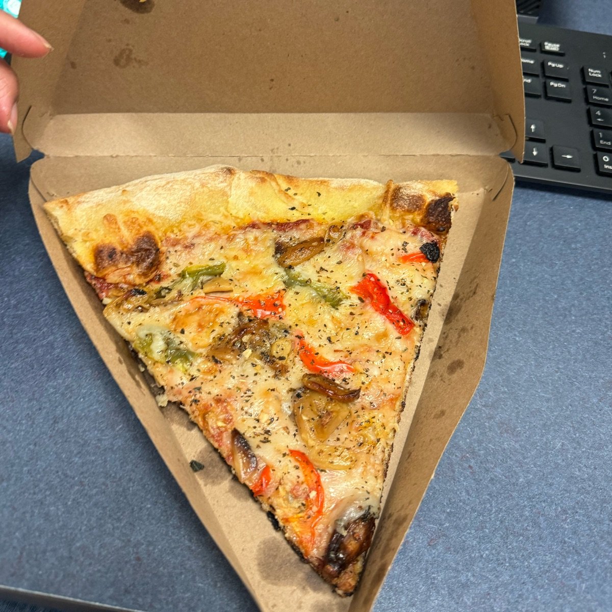 Hand-tossed vegan pizza slice from Whole Foods Market - Vegan Product