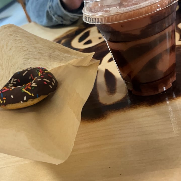 photo of Peace Love Coffee VEGAN Cafe & Market chocolate iced doughnut shared by @vegancheese on  14 Apr 2024 - review
