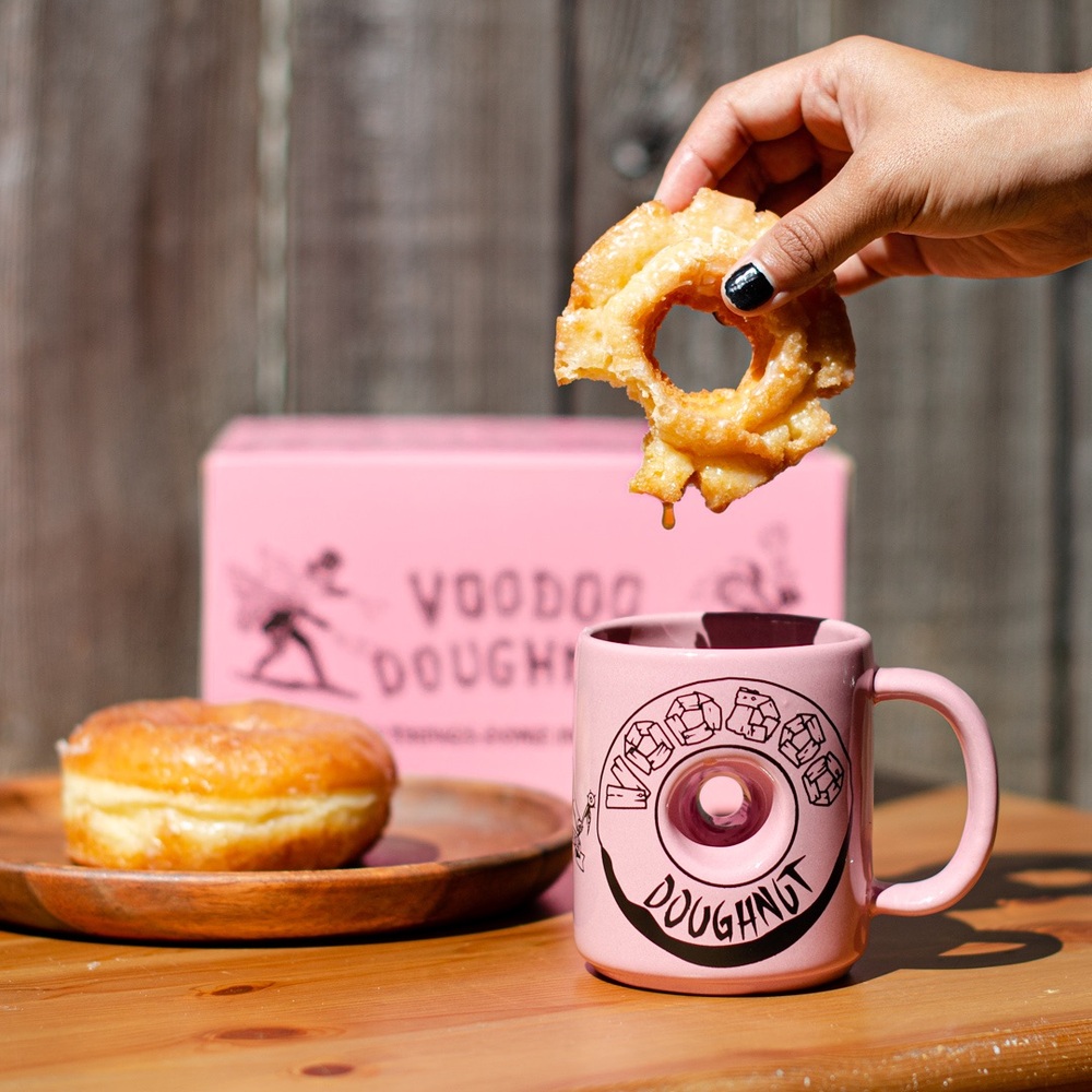 Vodoo Doughnut Glazed Donut dipped in coffee