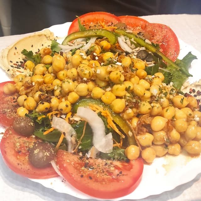 Photo of the dish “Oriental salad w/ hummus and seeds”