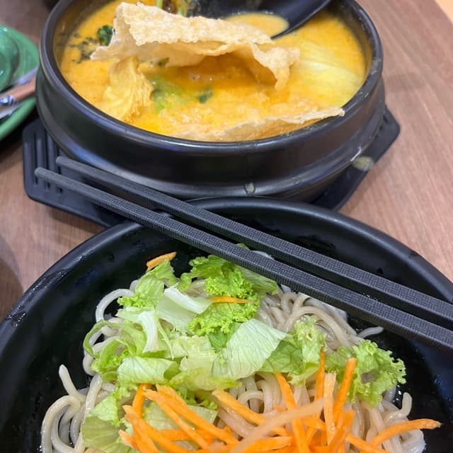 Photo of the dish “laksa soup bowl with dried ramen noodles”