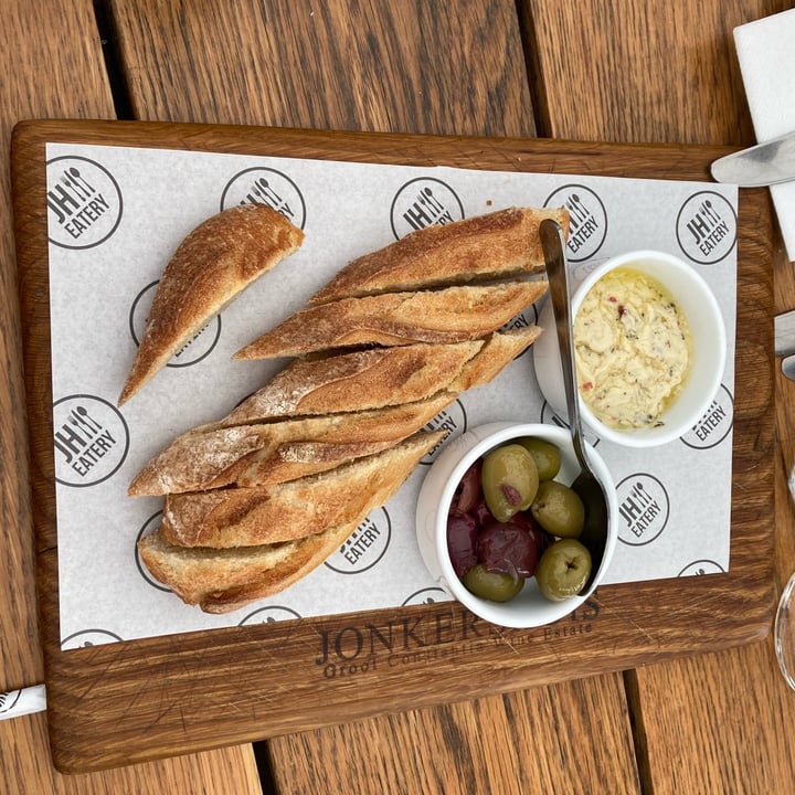 photo of Jonkershuis Restaurant South Africa Woodstock bakery baguette with olives and spiked margarine shared by @catherinews on  30 Apr 2023 - review