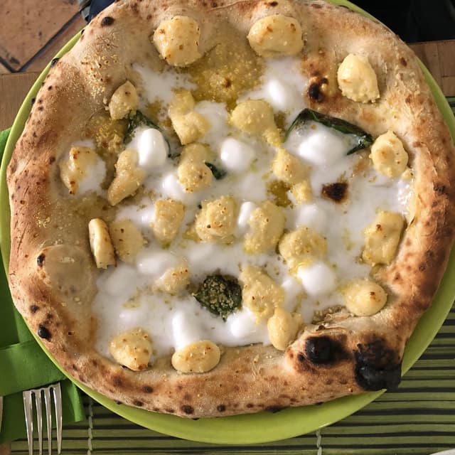 Photo of the dish “pizza quattro formaggi vegan”
