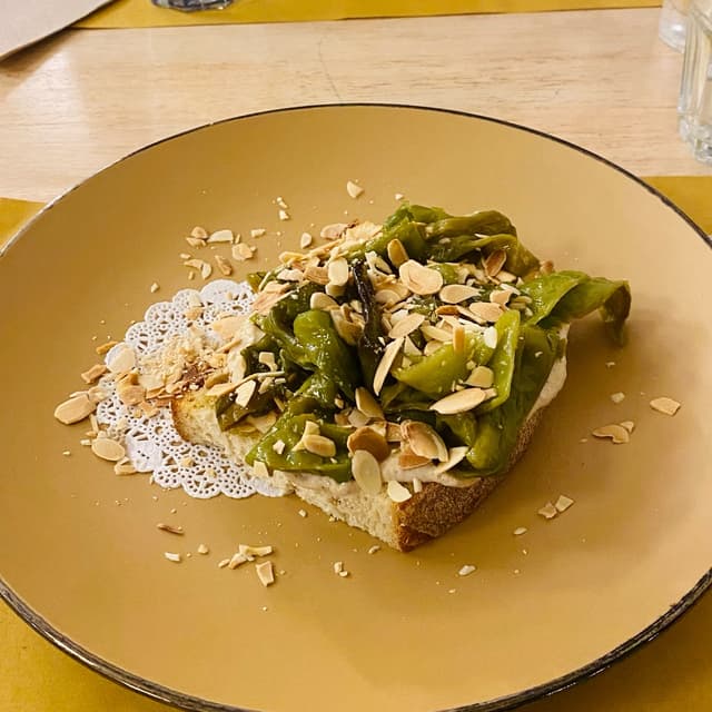 Photo of the dish “bruschetta con formaggio vegetale friggitelli e mandorle”