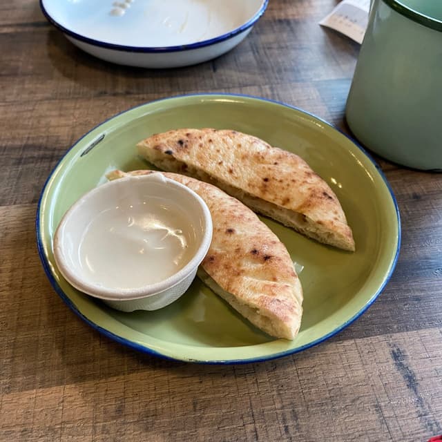 Photo of the dish “Hot Damn It's FREE FLOW PITA & TAHINI”