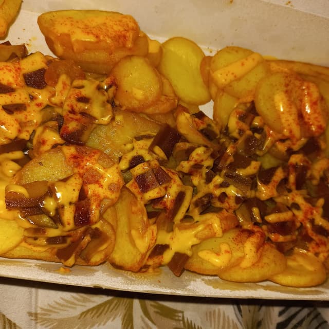 Photo of the dish “French Fries With Vegetable Bacon And Cheddar Sauce”
