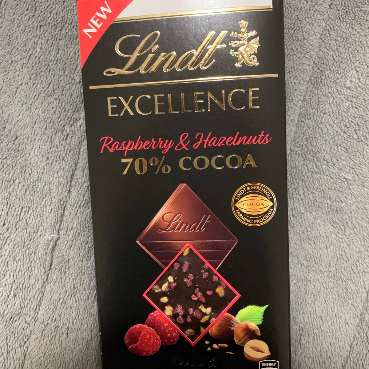 Coles Lindt Raspberry Lindt 70% Cocoa with Raspberries and Hazelnut Reviews | abillion