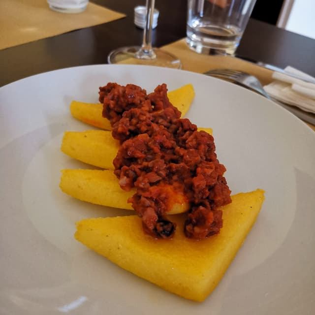 Photo of the dish “Polenta con ragù di noci”