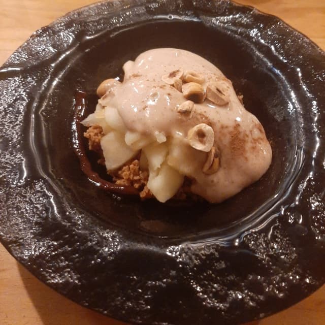 Photo of the dish “Mela Scottata Con Crumble Di Nocciole E Salsa Rum E Cannella”