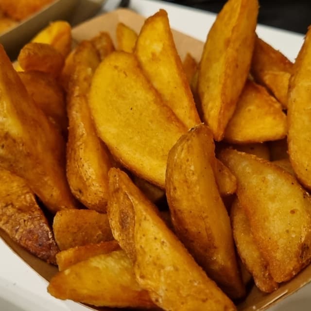 Foto do prato “Potato Wedges”