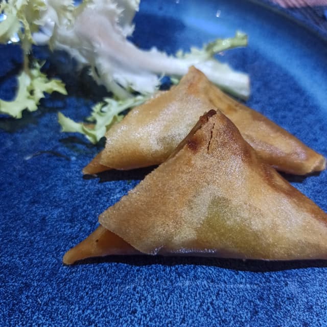 Foto del plato “triangoli al curry”