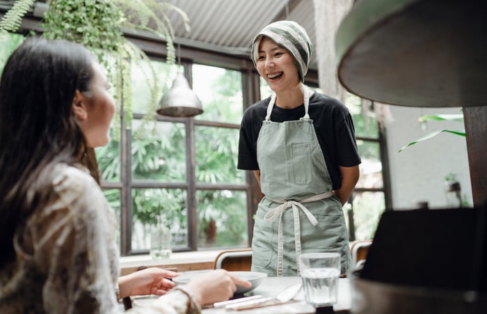 woman ordering food in a restaurant