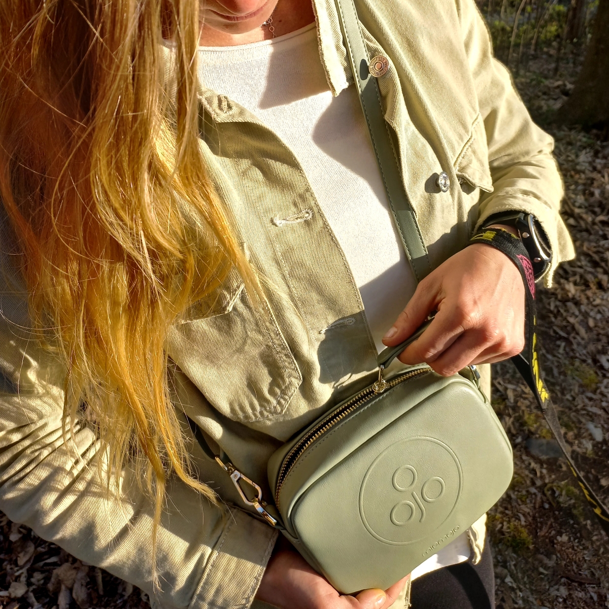 Miomojo Mimi Vegan Leather Bag - Woman holding green sling bag