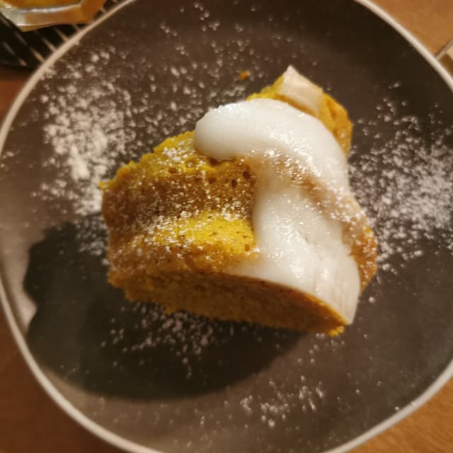Photo of the dish “CIAMBELLA VEGANA AL GOLDEN MILK E CREMA DI LATTE DI COCCO”