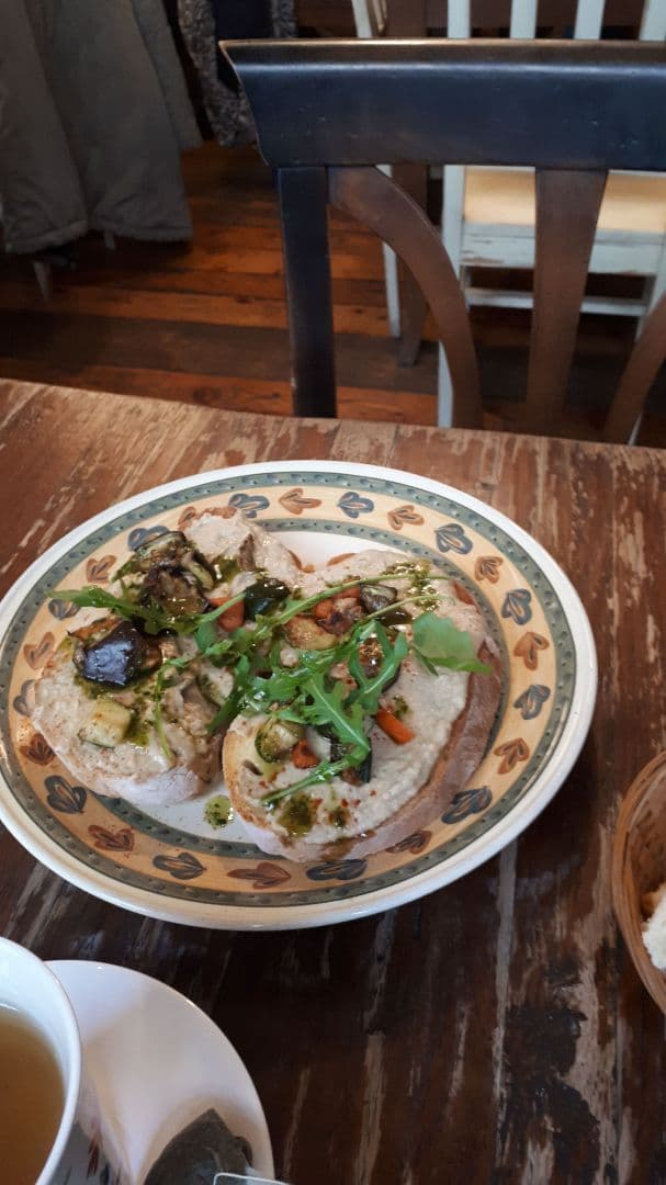 Photo of the dish “Bruschetta With Hummus, Dried Tomatoes and Rocket Salad”