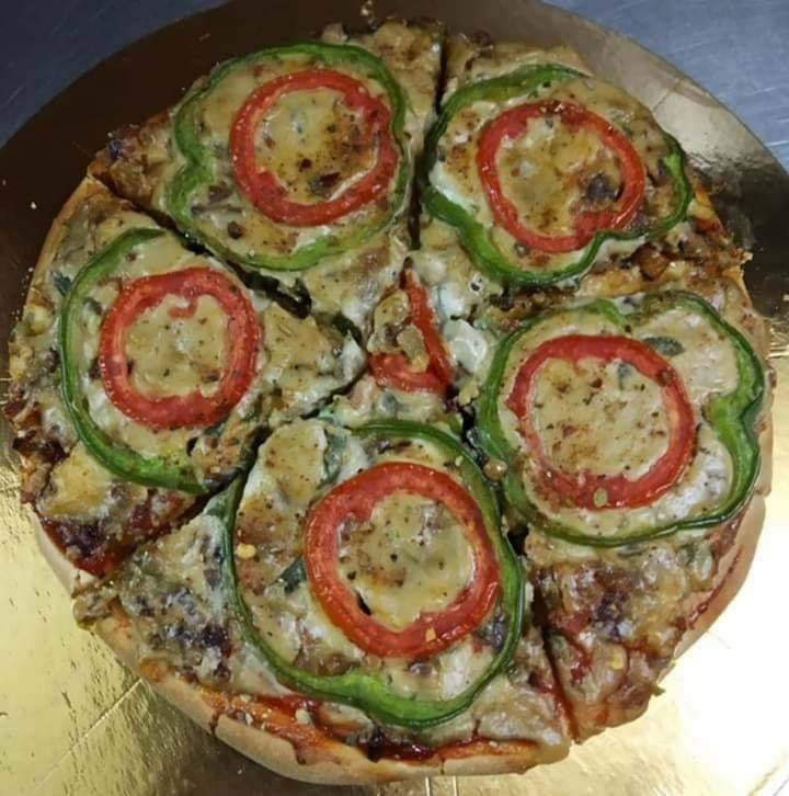 photo of The Loving Hut - Vegan Paradise Tomato capsicum pizza shared by @davinderhsi on  26 Feb 2020 - review