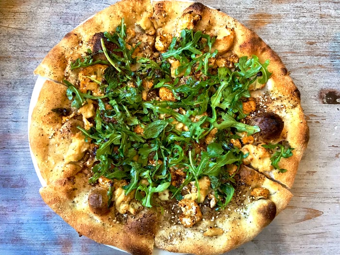 Cauliflower Za’atar Pizza. Available gluten-free and/or vegan.