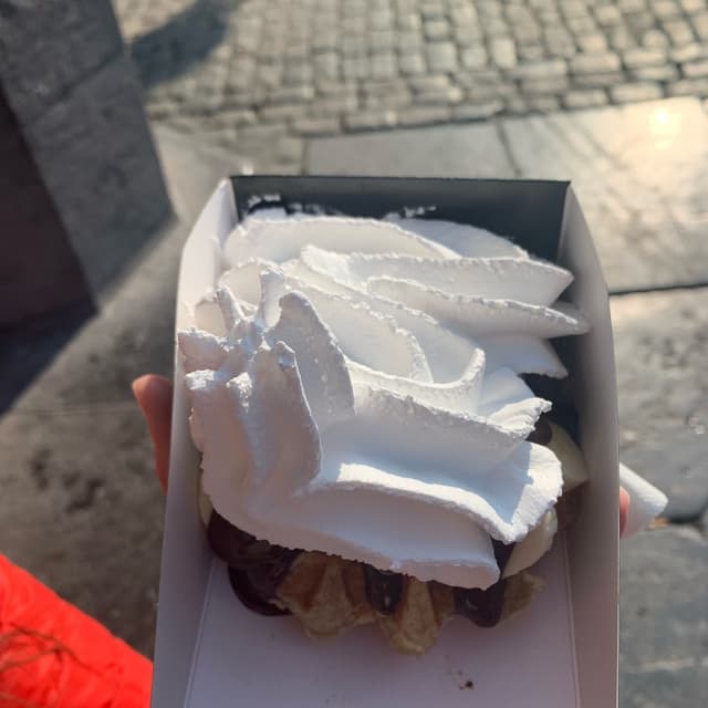 Photo of the dish “Belgian Waffle with Banana, Chocolate, and Cream”