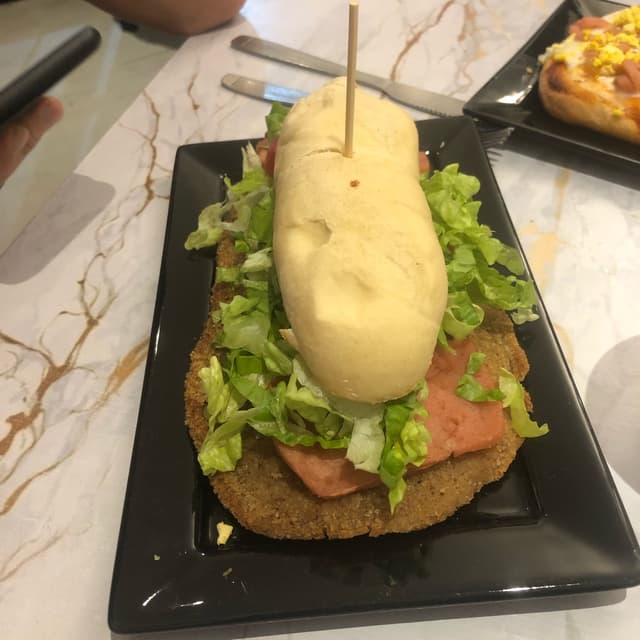 Photo of the dish “Sándwich de Milanesa Completo”