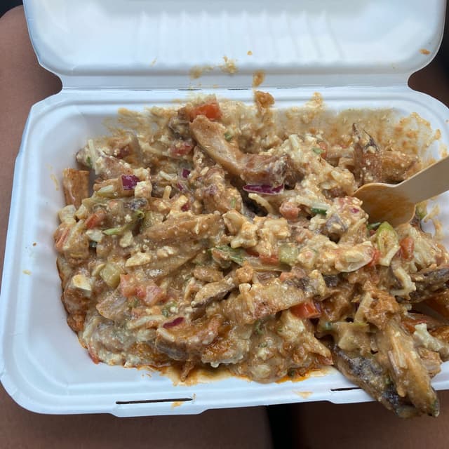 Photo of the dish “Butter chikken poutine”