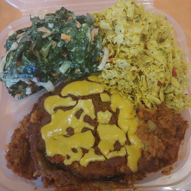 Photo of the dish “Egglplant Parm with Curry Yuba Salad and Ginger Collards”