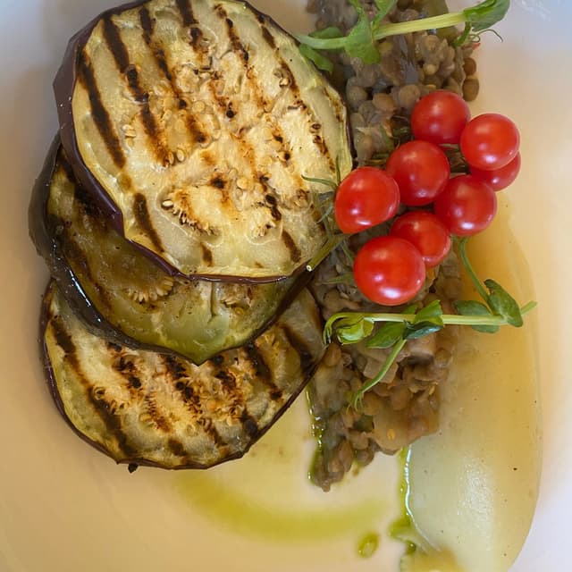 Photo of the dish “Grilled aubergine medallions served with lentils and veggies”