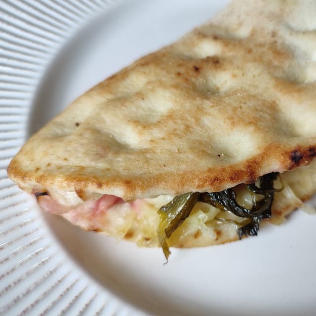 Foto del plato “Calzoncino Friarielli e Salsiccia”