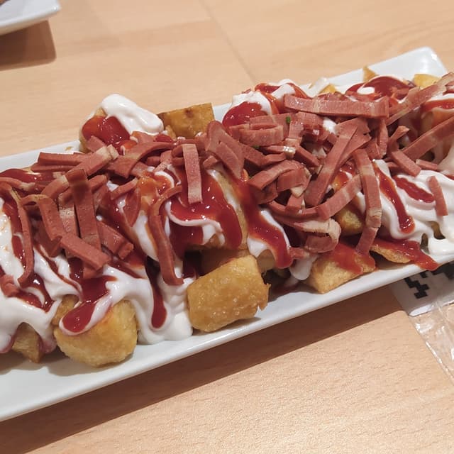 Foto del plato “Bravas bacon”