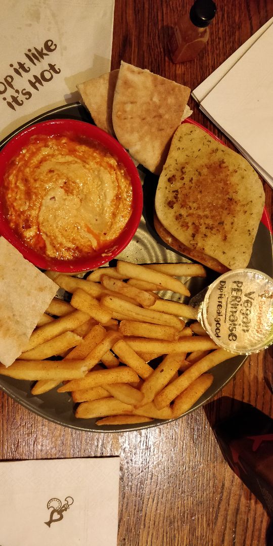 review photo of Nando's Camden Peri Peri Chips, Garlic Bread, Hummus With Peri Drizzle shared by @ktrose on 09 Mar 2020 - review