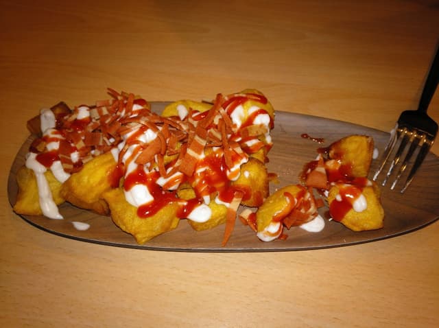 Photo of the dish “Patatas bravas con bacon”