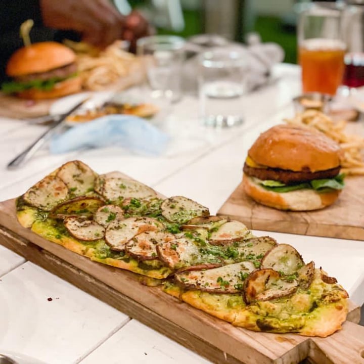 review photo of Little Pine Restaurant Potato pesto flatbread & Caesar salad shared by @theplantbasedbassist on 30 Oct 2022 - review