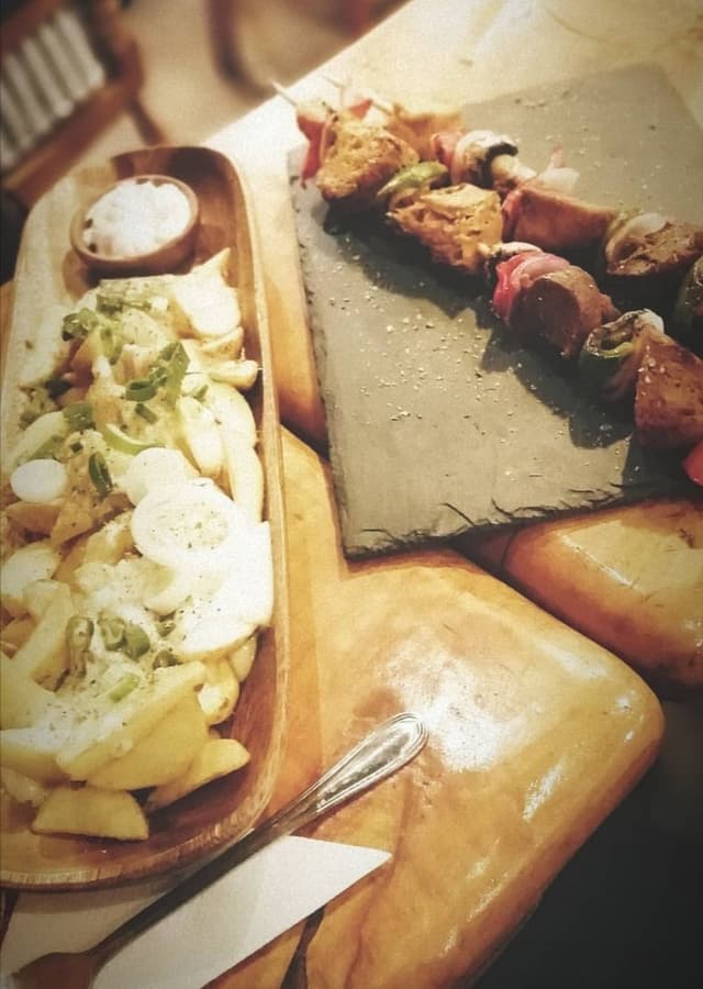 Photo of the dish “Papas Y Anticuchos”