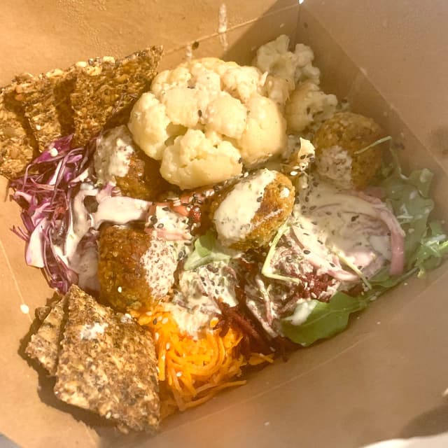 Photo of the dish “cauliflower tahini bowl with hemp balls”