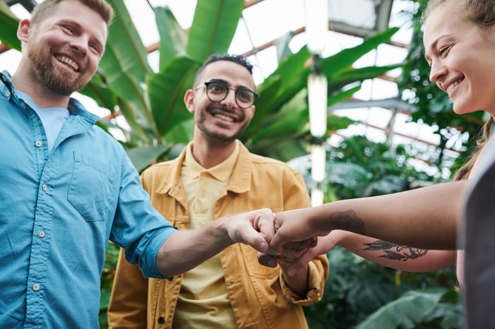 people fist bumping