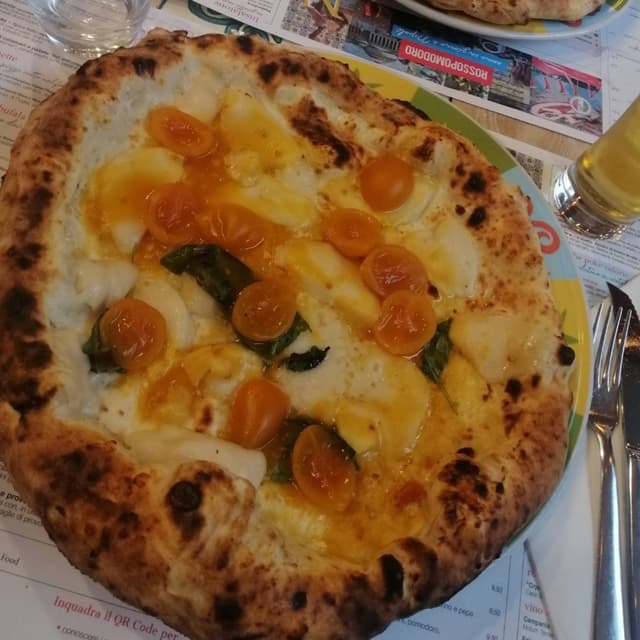Foto do prato “Pizza con Datterini Gialli e Mozzarisella”