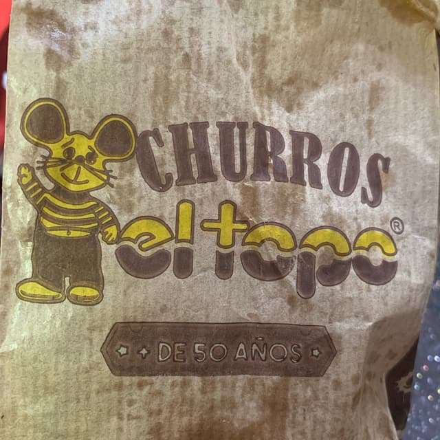 Foto do prato “Churro relleno de ganache de chocolate”