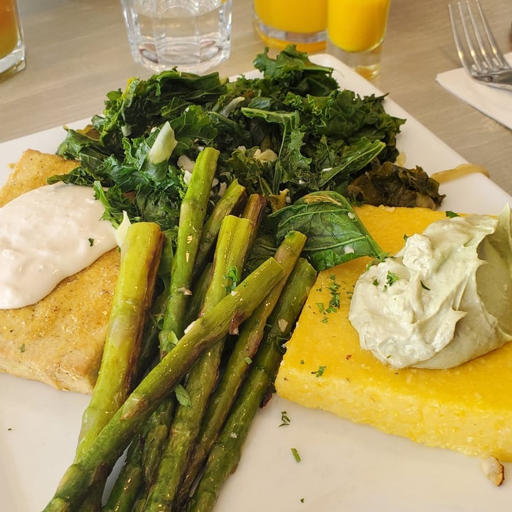 review photo of Garden Cafe Woodstock black & white peppercorn crusted tofu with a roasted garlic sauce, polenta with avocado mousse and truffle salt, sauteed greens and vegetable of the day shared by @rosiesully on 22 Nov 2022 - review