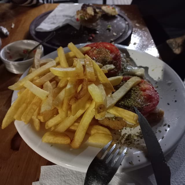 「Milanesa napolitana con papas」の料理の写真