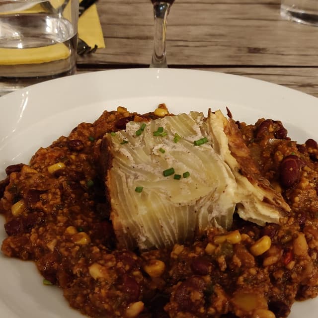 Photo of the dish “Pomme de terre rotie, tapenade, pistou, graines germe Et Noisette”
