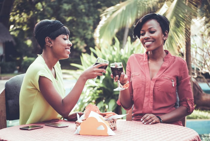 couple drinking wines in a vineyard