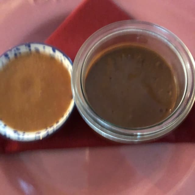 Foto do prato “Budino al cioccolato vegan con coulis di pesche”