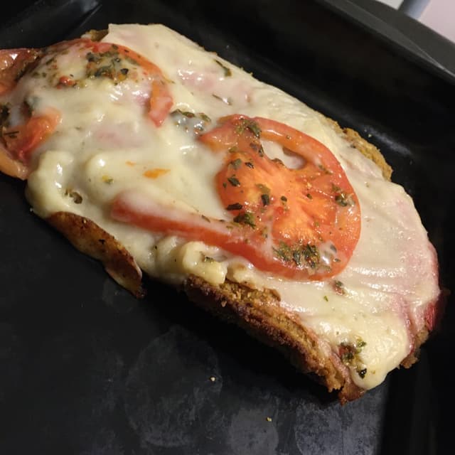 Photo of the dish “Milanesa Con Jamón, Queso Y Tomate”