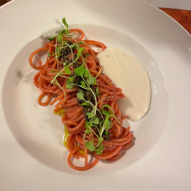 Photo of the dish “SpaghettOro affumicati ‘’cotti a freddo’’, Estratto Di Barbabietola, Germogli di Rucola E Tartufo”