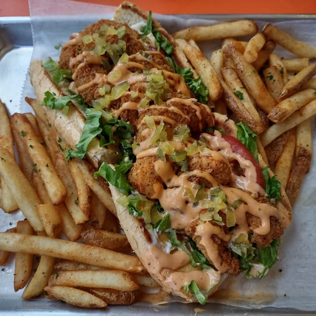 Photo of the dish “"The Rich Man" Shrimp Po' Boy Sandwich and Fries”